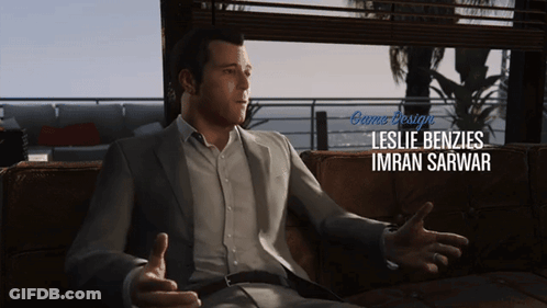 A Man Sitting On A Couch With The Name Leslie Benzies Imran Sarwar GIF