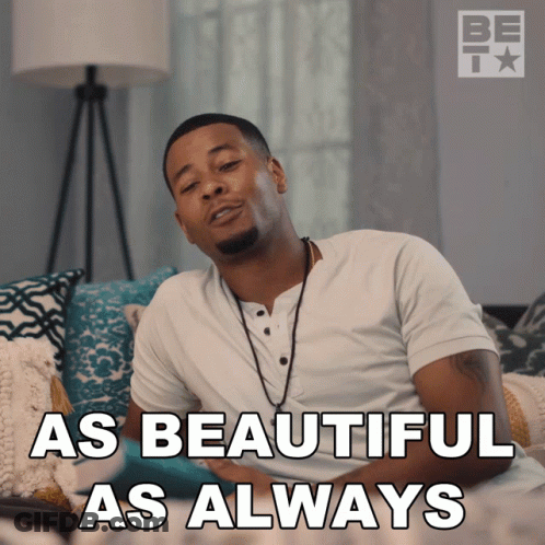 A Man Sitting On A Couch With The Words " As Beautiful As Always " GIF