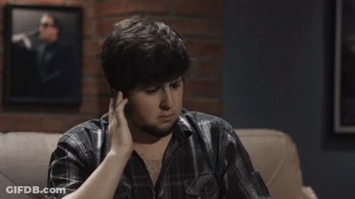 A Man Sitting On A Couch With The Words " Did They Stroke Out " Above Him GIF