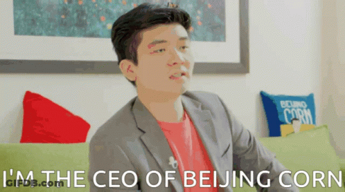 A Man Sitting On A Couch With The Words I 'M The Ceo Of Beijing Corn GIF