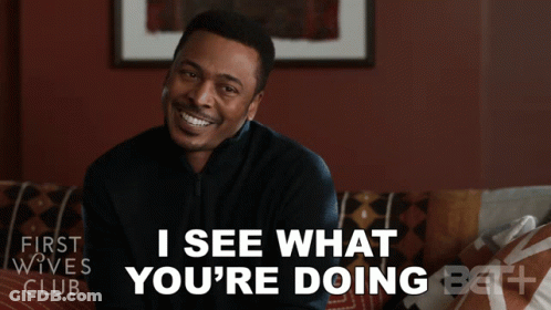 A Man Sitting On A Couch With The Words " I See What You 'Re Doing " GIF