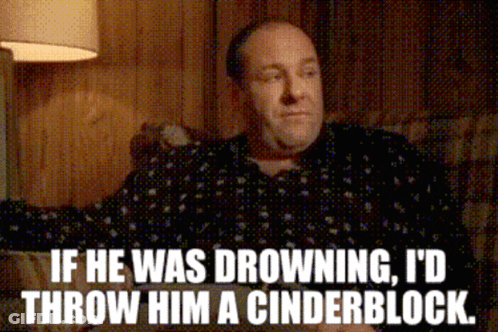 A Man Sitting On A Couch With The Words If He Was Drowning I D Throw Him A Cinderblock GIF