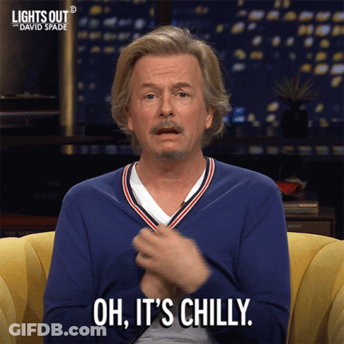 A Man Sitting On A Couch With The Words Oh It 'S Chilly On His Face GIF