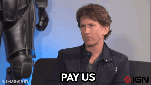 A Man Sitting On A Couch With The Words Pay Us Above Him GIF