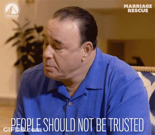 A Man Sitting On A Couch With The Words People Should Not Be Trusted Written Below Him GIF