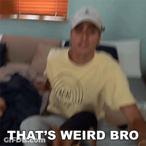 A Man Sitting On A Couch With The Words That 'S Weird Bro Written Below Him GIF