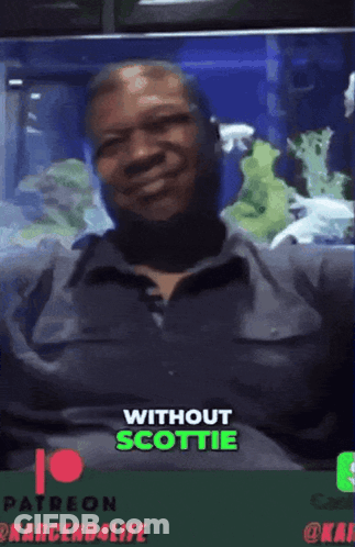 A Man Sitting On A Couch With The Words " Without Scottie " On The Bottom Right GIF
