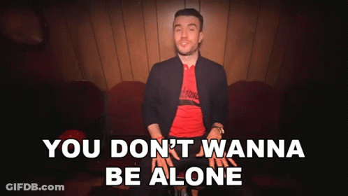 A Man Sitting On A Couch With The Words " You Don T Wanna Be Alone " GIF