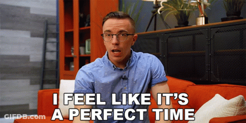 A Man Sitting On A Red Couch With The Words I Feel Like It 'S A Perfect Time Above Him GIF