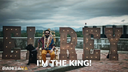 A Man Sitting On A Throne Next To A Dog With The Words I 'M The King On The Bottom GIF