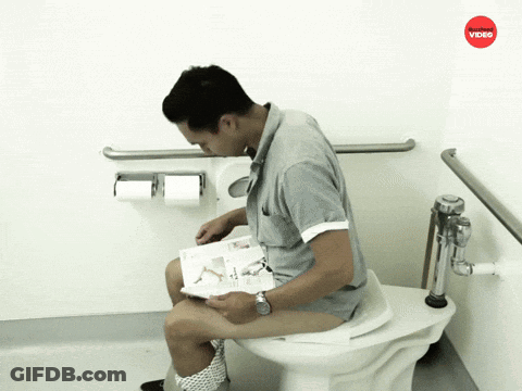 A Man Sitting On A Toilet Reading A Magazine With A Red Video Logo Above Him GIF