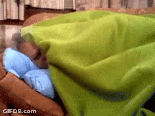 Man Sleeping Under Green Blanket On Bed GIF