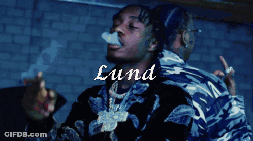 A Man Smoking A Cigarette With The Name Lund Written On The Bottom GIF