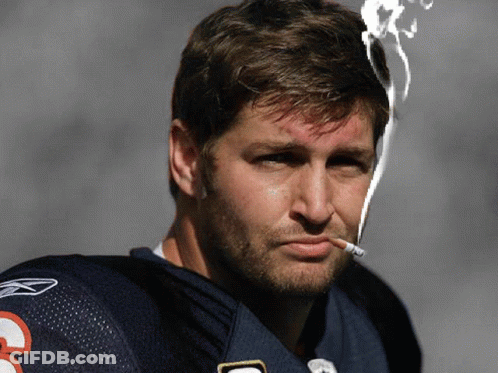 A Man Smoking A Cigarette With The Number 3 On His Shirt GIF
