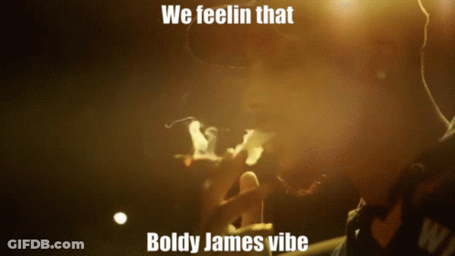 A Man Smoking A Cigarette With The Words We Feelin That Boldy James Vibe GIF