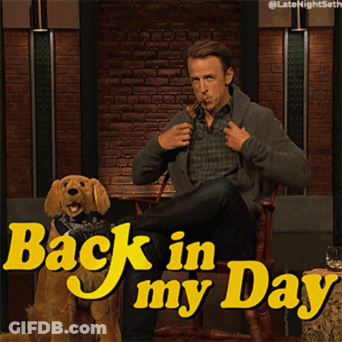 A Man Smoking A Pipe Next To A Dog With The Words Back In My Day On The Bottom GIF