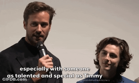 A Man Speaking Into A Microphone Next To Another Man With The Words " Especially With Someone As Talented And Special As GIF