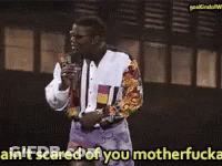 A Man Speaking Into A Microphone With The Words Ain T Scared Of You Motherfucker GIF