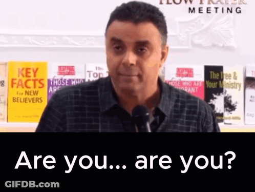 A Man Speaking Into A Microphone With The Words Are You Are You GIF