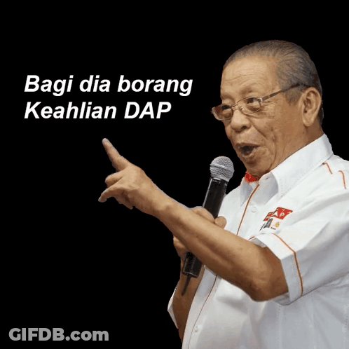 A Man Speaking Into A Microphone With The Words " Bagi Dia Borang Keahlian Dap " On The Bottom GIF