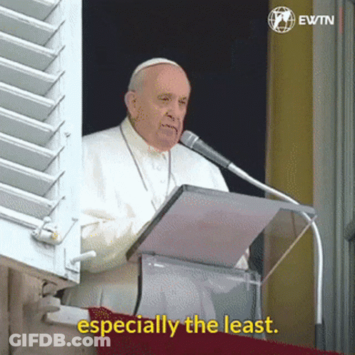 A Man Speaking Into A Microphone With The Words " Especially The Least " Next To Him GIF