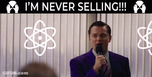 A Man Speaking Into A Microphone With The Words I 'M Never Selling Behind Him GIF