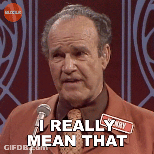 A Man Speaking Into A Microphone With The Words " I Really Mean That " Above Him GIF