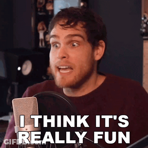 A Man Speaking Into A Microphone With The Words I Think It 'S Really Fun GIF