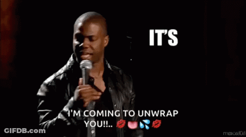 A Man Speaking Into A Microphone With The Words It 'S About To Go Down Behind Him GIF