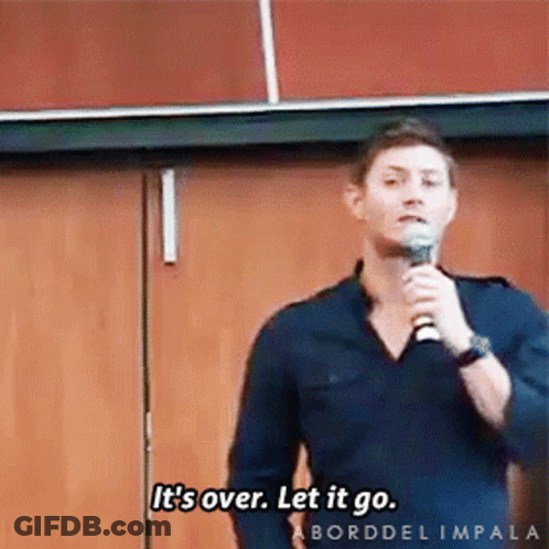 A Man Speaking Into A Microphone With The Words It 'S Over Let It Go GIF