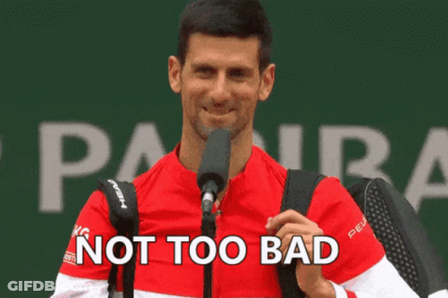 A Man Speaking Into A Microphone With The Words " Not Too Bad " Written Below Him GIF