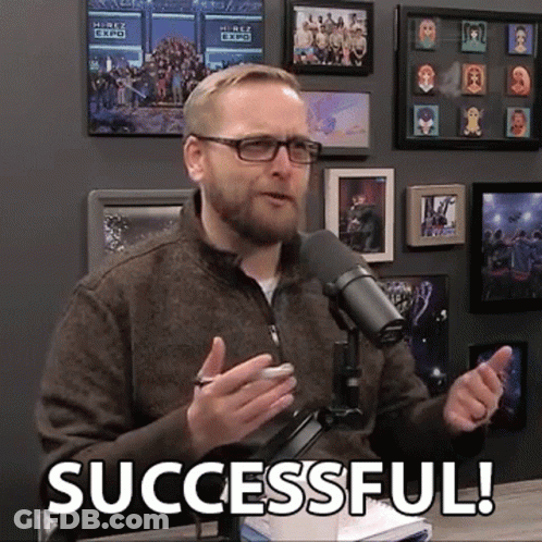 A Man Speaking Into A Microphone With The Words Successful Written On The Bottom GIF