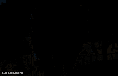 A Man Squatting Down In Front Of A Screen That Says ' I See His Face ' On It GIF
