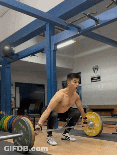 A Man Squatting Down With A Barbell That Says Eleko GIF