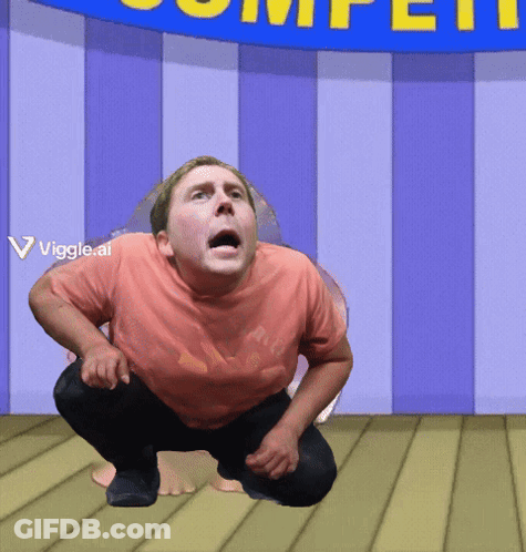 A Man Squatting In Front Of A Blue Sign That Says Competition GIF