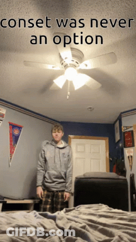 A Man Standing In A Bedroom With The Words Conset Was Never An Option On The Bottom GIF