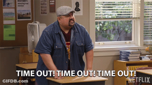 A Man Standing In A Classroom Says Time Out GIF