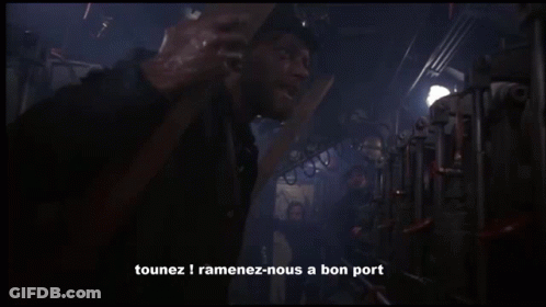 A Man Standing In A Dark Room With The Words " C'est Un Ordre " Written On The Bottom GIF