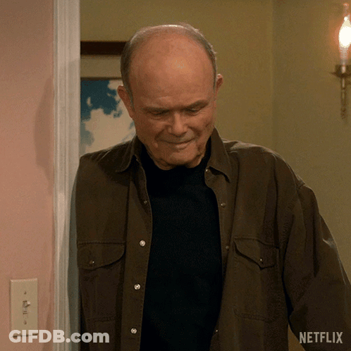 A Man Standing In A Doorway With A Netflix Logo On The Bottom GIF
