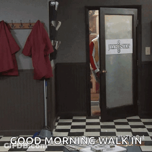 A Man Standing In A Doorway With The Words " Good Morning Walk In " On The Bottom GIF