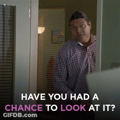 A Man Standing In A Doorway With The Words Have You Had A Chance To Look At It Below Him GIF