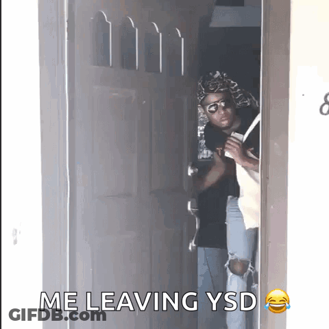 A Man Standing In A Doorway With The Words " Me Leaving Ysd " On The Bottom GIF