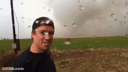 A Man Standing In A Field With A Hat That Says ' U.s. Army ' On It GIF