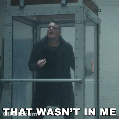 A Man Standing In A Glass Box With The Words That Wasn 'T In Me Above Him GIF