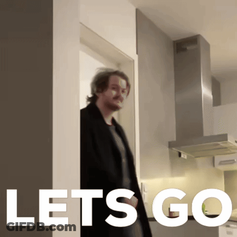 A Man Standing In A Kitchen With The Words Let 'S Go On The Bottom GIF