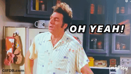 A Man Standing In A Kitchen With The Words Oh Yeah Behind Him GIF