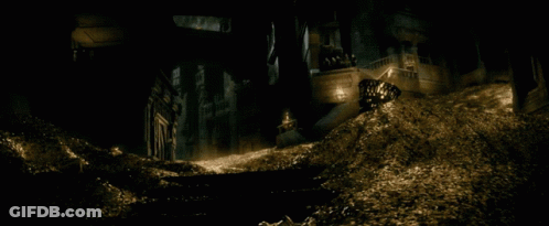 A Man Standing In A Pile Of Gold With The Words Beyond Sorrow Written On The Bottom GIF