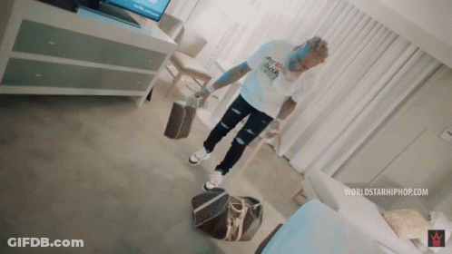 A Man Standing In A Room With A Worldstarhiphop.com Watermark GIF