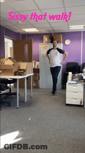 A Man Standing In A Room With The Words Sissy That Walk Written Above Him GIF