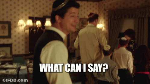 A Man Standing In A Room With The Words What Can I Say Written On The Bottom GIF